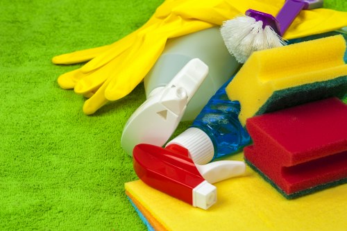 Professional carpet cleaner using PPE during a safe cleaning job